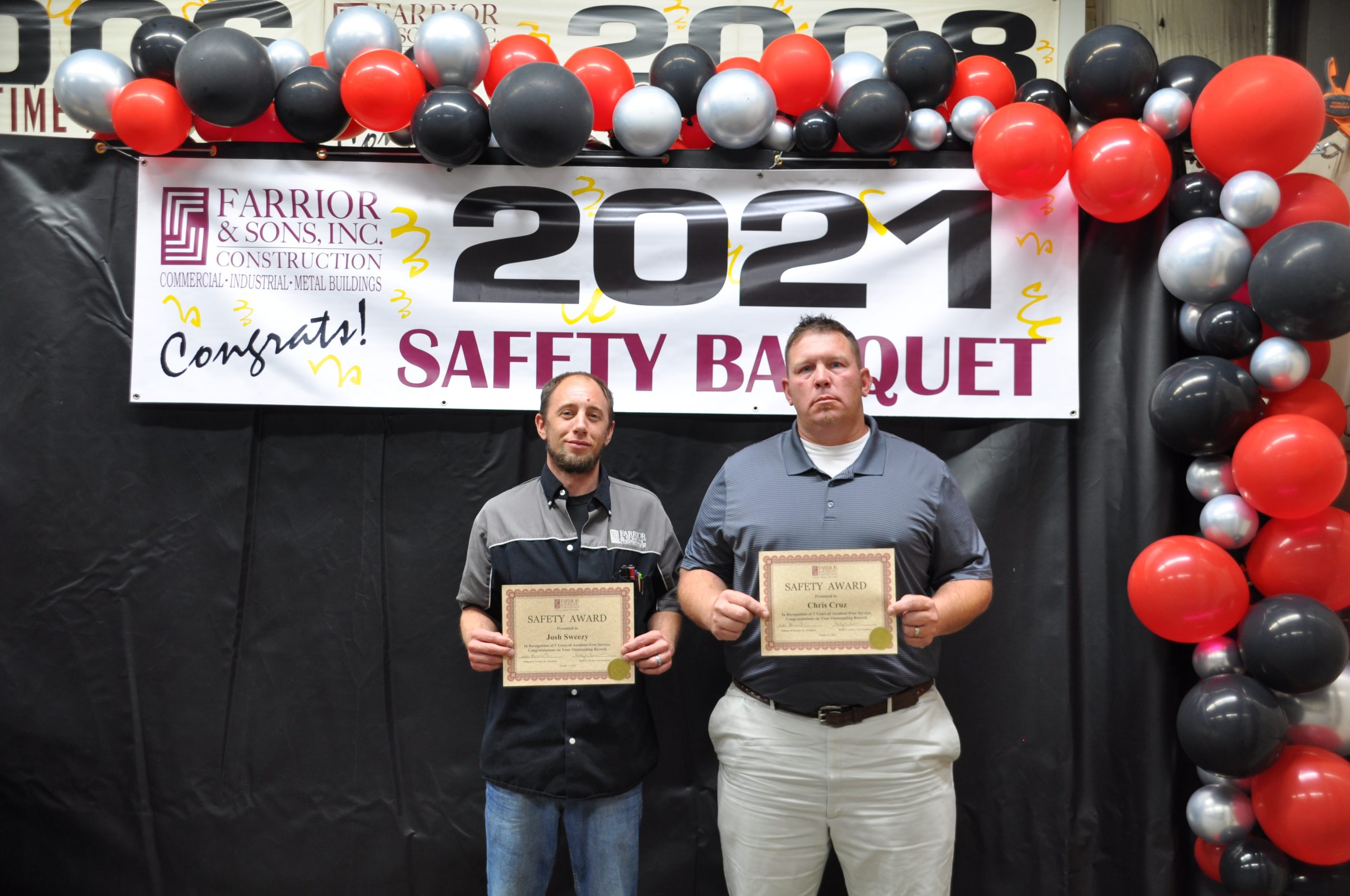 men holding 2021 Safety Banquet awards