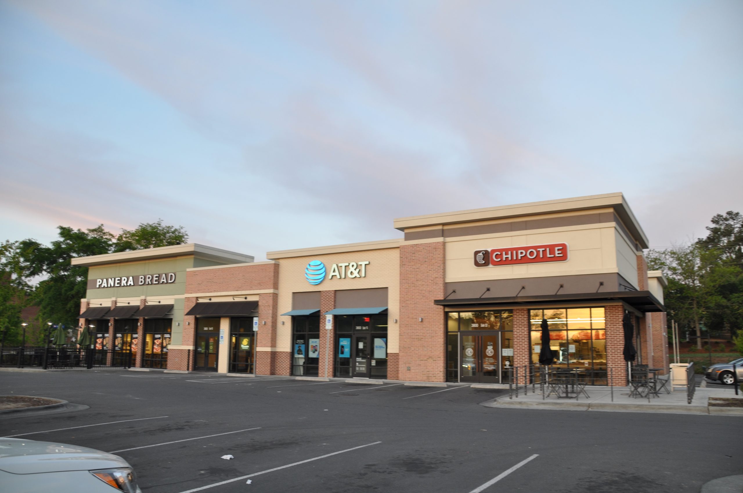 empty parking lot of Panera Bread, At&T, and Chipotle